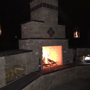Lit Outdoor Fireplace Wall
