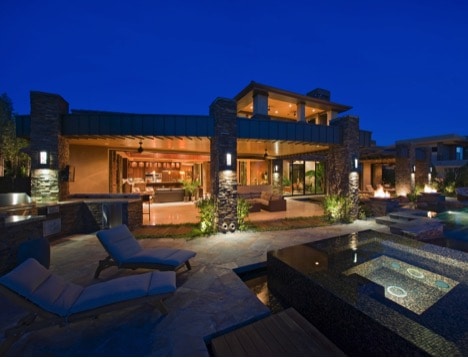 home with interlock patio and exterior lighting