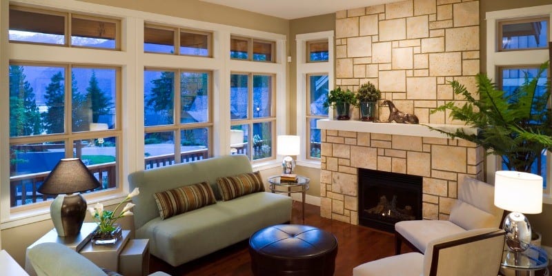 Tan coloured Fireplace and mantel in living room