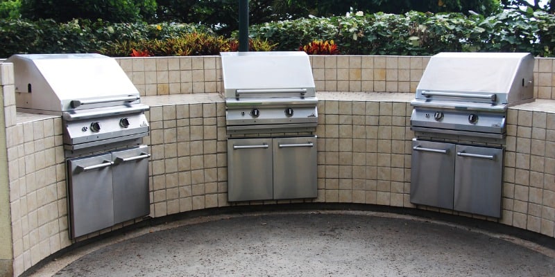 three stainless steel gas BBQ grills